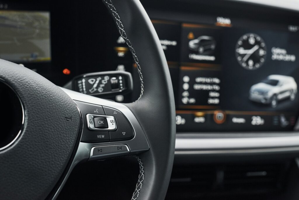 Interior of a prestigious modern black car. Leather comfortable seats and accessories and steering